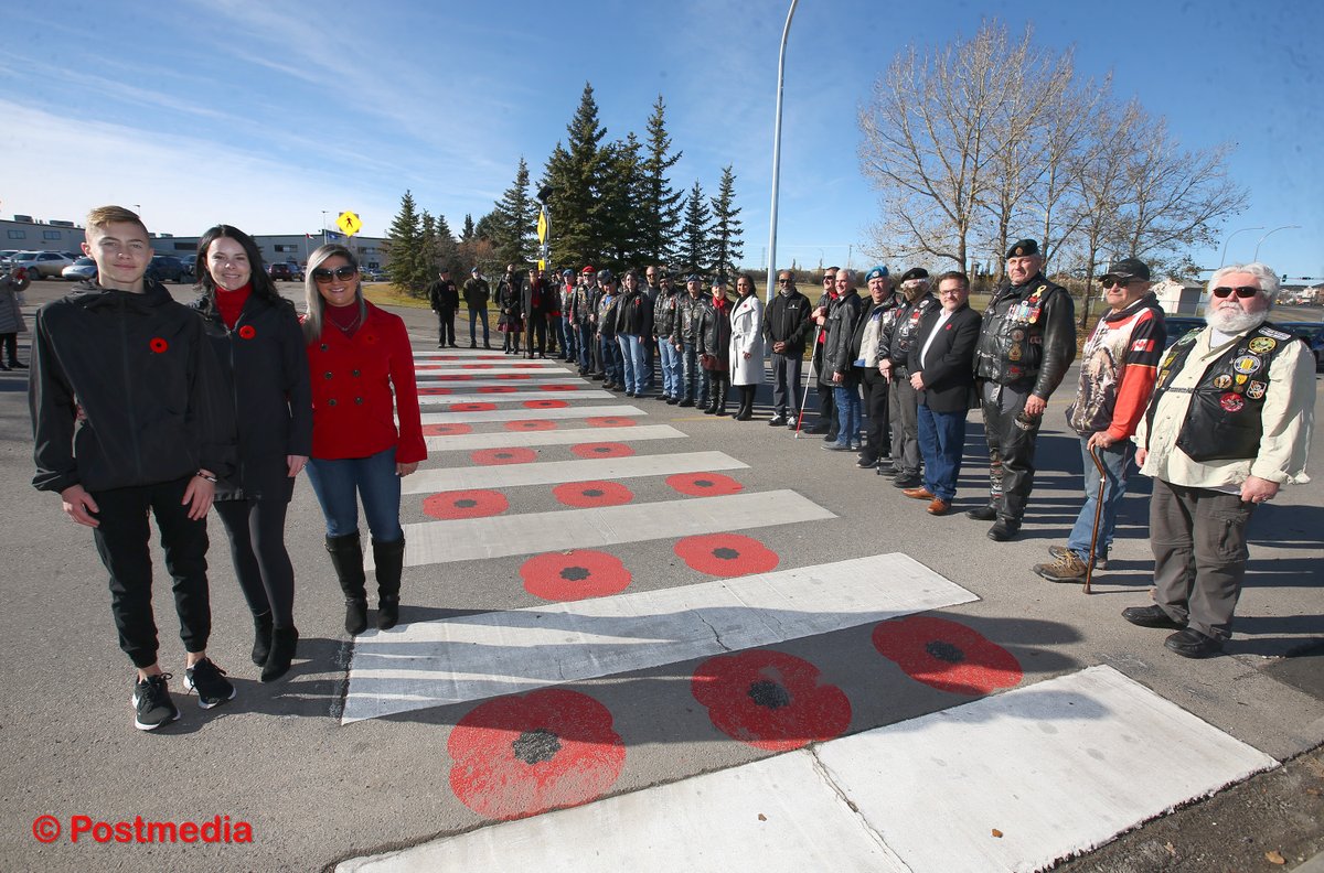 JimWellsphoto's tweet photo. The @CityChestermere officially opened a crosswalk decorated with poppies after local teen Keigan Davies thought veterans should be remembered and thanked year round @LeelaAheer #RemembranceDay https://t.co/HE6zekVPcx