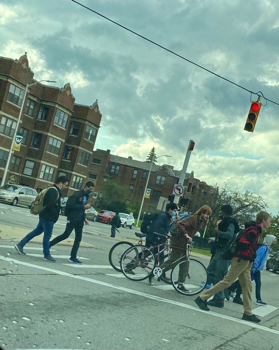 DezTanieStover's tweet photo. Wayne State University students cross the street at Warren Ave. & Second St. on a cloudy, windy Thursday afternoon. This week marked the 8th week of the semester, otherwise known as the midterm week. (By DezTanie Stover) #WSUpj #A5a #featurephotography #photojournalism @intro2pj https://t.co/AxTRMQu20v