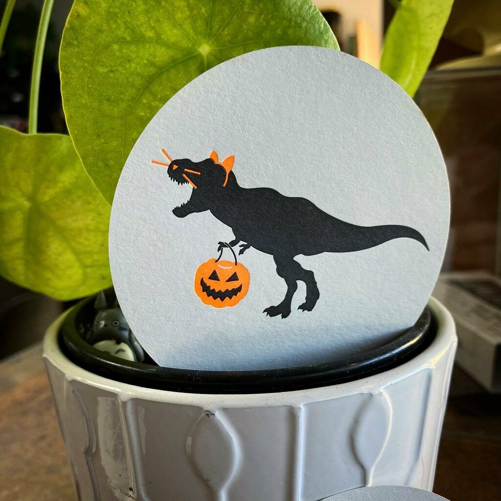 SkylabLtrpress's tweet photo. Not a lotta ‘bigger and taller’ costumes for the T-rex, ya know. 

Free with every spooky purchase!

Printed on French Paper Grout Grey cover with fluorescent orange and black ink. 

#letterpress 
#printing #press #heidelbergwindmill #orange #ink #paper … https://t.co/1ymhiFirBc https://t.co/4l0pahzNSs