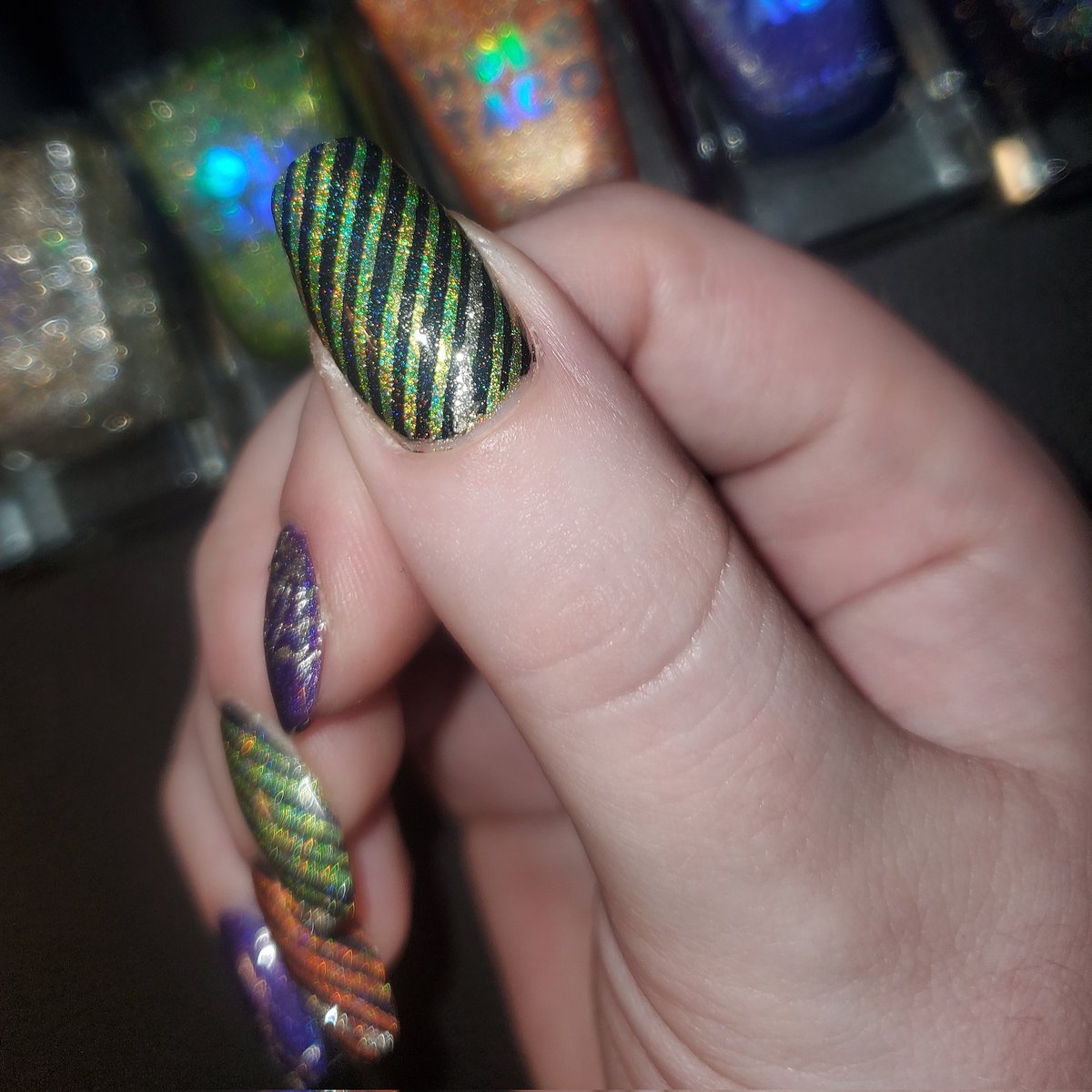 kathrynh408's tweet photo. My #HoloTacoHoloween2021 nail art w/ @holotaco's electrostatic, purple slushie, orange drink, full charge, &amp; gift receipt! Check out those #rainbow shifts 😍🌈💿🌮 (all on my dominant #otherhand bc I've got a nail break on my left 😭😬🙃) https://t.co/X0NFJCSEZd