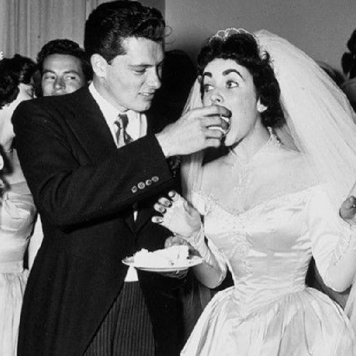 HollywoodForev4's tweet photo. Prince Rainier of Monaco in 1956.Opting for a classic style, Elizabeth Taylor wore a lace and ivory satin dress, with a full skirt and pearl embroidery. The wedding dress went down in fashion history and was eventually sold at auction at Christie's on June 26. https://t.co/WnceqN4BOz