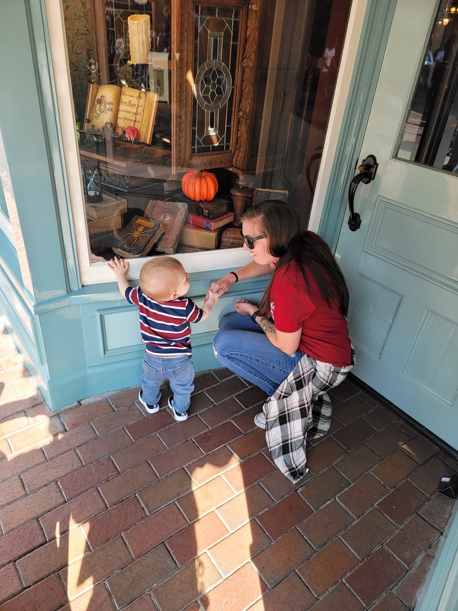 fireeeball_'s tweet image. He was OBSESSED with the window displays at Disney 😂