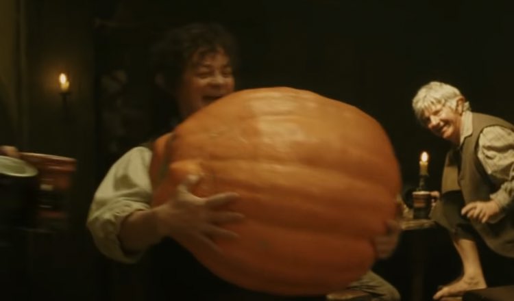 myelessar's tweet photo. this hobbit being really happy about his giant pumpkin is the biggest october mood 🍂🎃 https://t.co/uSs8U42Ss3