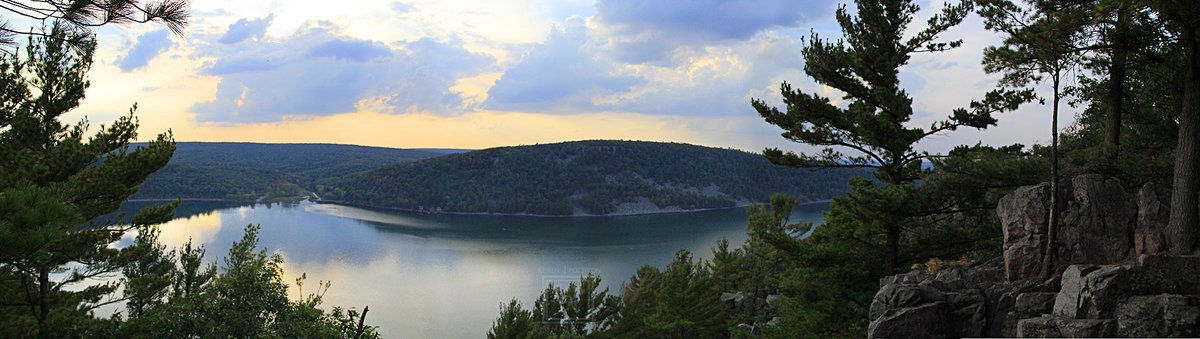 On the East Bluff Trail at #Sunset at Devil's Lake State Park- Baraboo, Wisconsin. Hand done #Panoramic photo taken on one of the bluffs (10-1-2021) #CanonFavPic #Canon60D #PanoramicPhotography #Landscape #LandscapePhotography #Photography #Trees #Water #KevinPochronPhotography