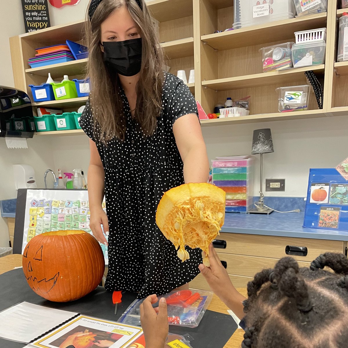 teacha_grace's tweet photo. It’s my favorite day!!! Pumpkin Jack is all carved and ready for trick or treaters! The kids loved playing with the seeds, putting candles inside and watching him glow! 🧡🖤🎃 #aac #augcomm #assistivetechnology #bettertogether https://t.co/JJYRG5yl6U