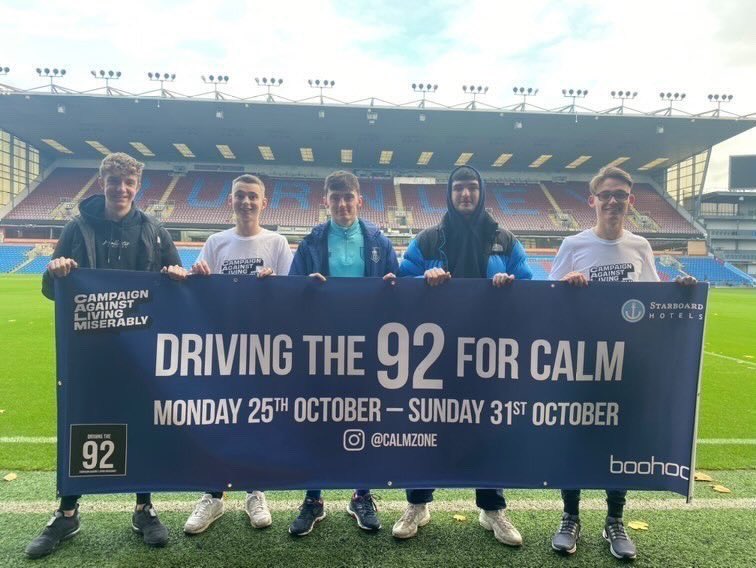 ClaretsAcademy's tweet photo. 👏 U18s midfielder Will Couch pictured with his friends this morning, who are visiting all 92 stadiums in the top four divisions this week, raising money for mental health and suicide awareness charity @theCALMzone, the young lads have already raised just under £5000! 👏 https://t.co/TVosntCna3