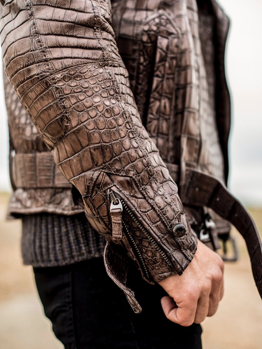 Honoring Mother Nature’s artistry.

Meticulously sewn to retain nature’s contiguous patterns, the men’s crocodile jacket embodies a rugged sophistication. Discover the original creation via link in bio.