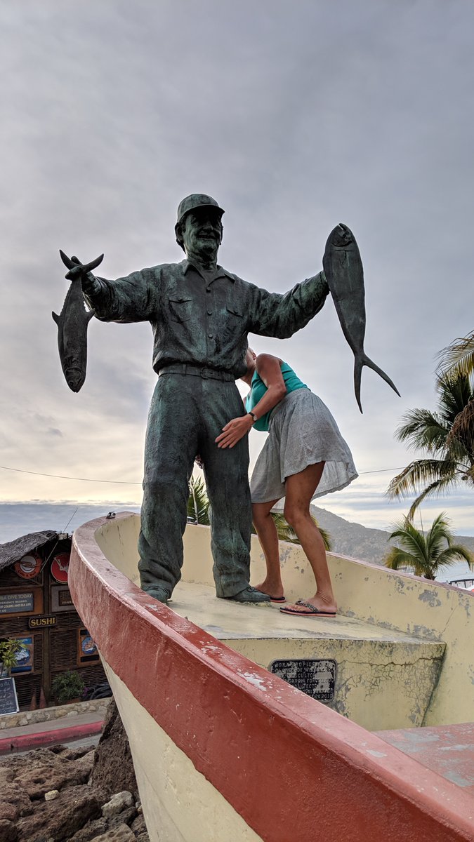 Here's another #Top4Oops with apologies to my dear UK friend Linda.

No, she's not feeling up or frisking this fisherman statue. She's just trying to climb up there to take a shot with it.