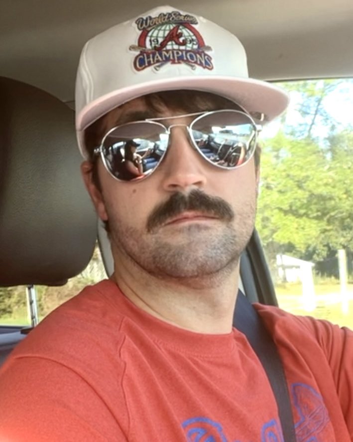 nikkidunagan's tweet photo. My husband shaved his entire beard bc he saw this photo of Dale wearing the Braves ‘95 World Series hat. https://t.co/PJycbRB4PC