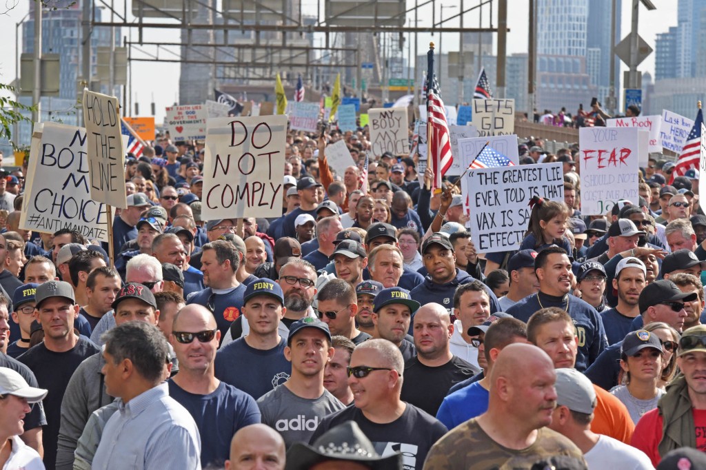 nypost's tweet photo. 'We will not comply!': NYC workers protest vax mandate with march across Brooklyn Bridge https://t.co/3zHCtbXc7w https://t.co/vyzHY6LvBi