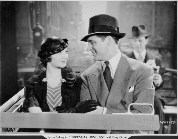 TimeMachineHQ's tweet photo. #SylviaSidney and #CaryGrant  in a scene from #ThirtyDayPrincess, 1934.📽 https://t.co/x5icYhb5bB