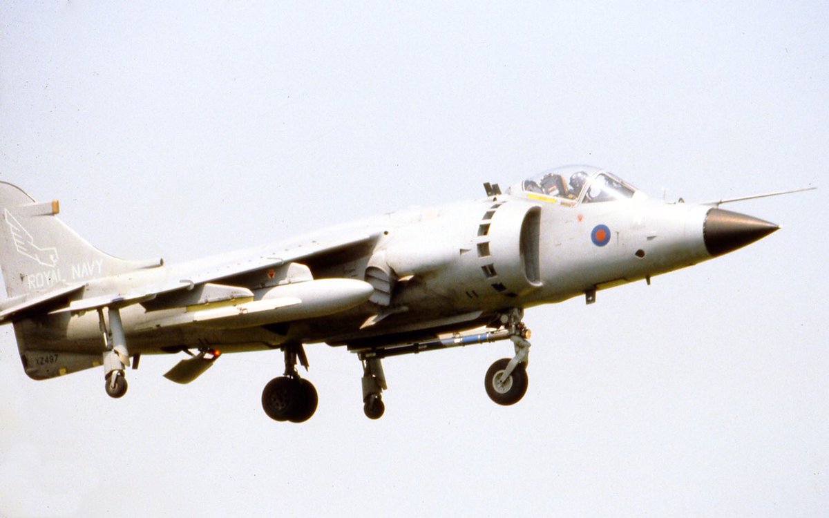 HarrierPres's tweet photo. In 1983, two former 809NAS FRS.1s joined 899NAS, and they kept their low cos grey scheme, here’s one of them XZ497 coming into land back at @RNASYeovilton in mid 1983. Note only a single training sidewinder is being carried. #899NAS #SHAR #SeaharrierFRS1 #Harrierpres https://t.co/bPQsxOg3gJ