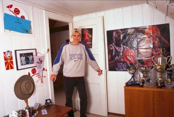 A 17-year-old Roger Federer with pin-ups of Shaq, Jordan and Pamela Anderson in his bedroom in Basel.