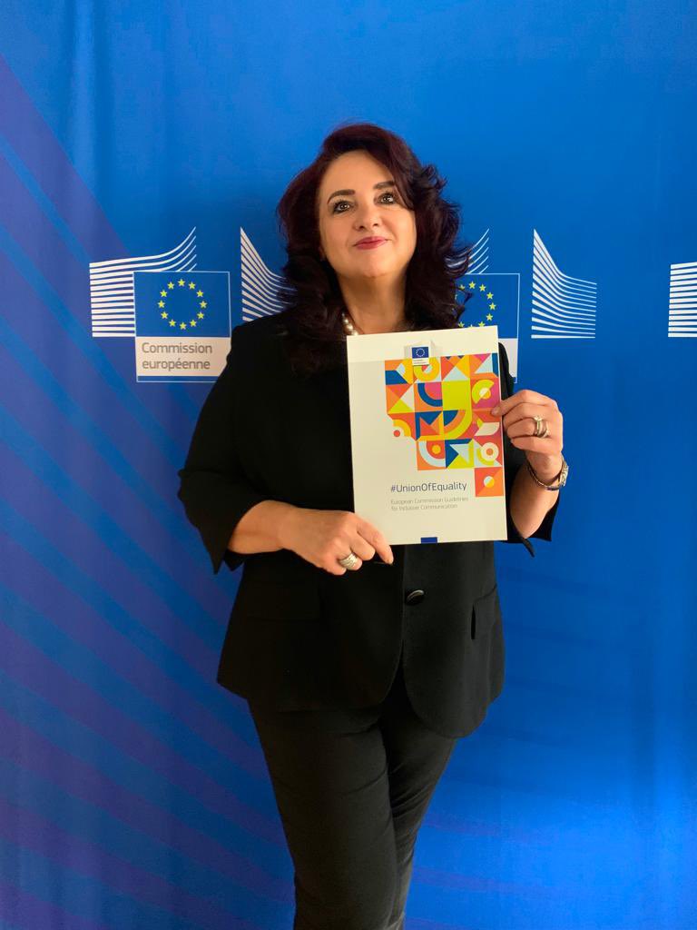 Commissioner holding the guidelines