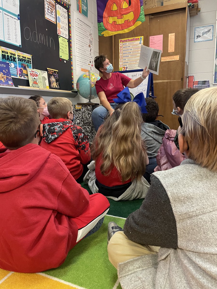 My job gets a little stressful sometimes. Sitting on the carpet while listening to a story with a group of sweet kids always brightens my day.  Kids>Paperwork