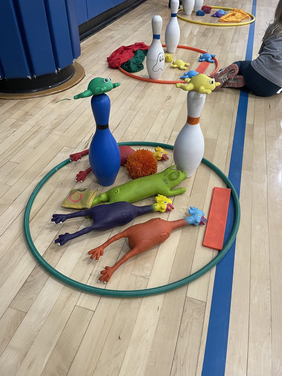 Students decorated their cookies with a partner today! Partners took turns underhand tossing from various spots into buckets. If they made it in they got to go trick or treating for one item from the baskets filled with goodies to use on their cookie. #Physed #Underhand #Creative