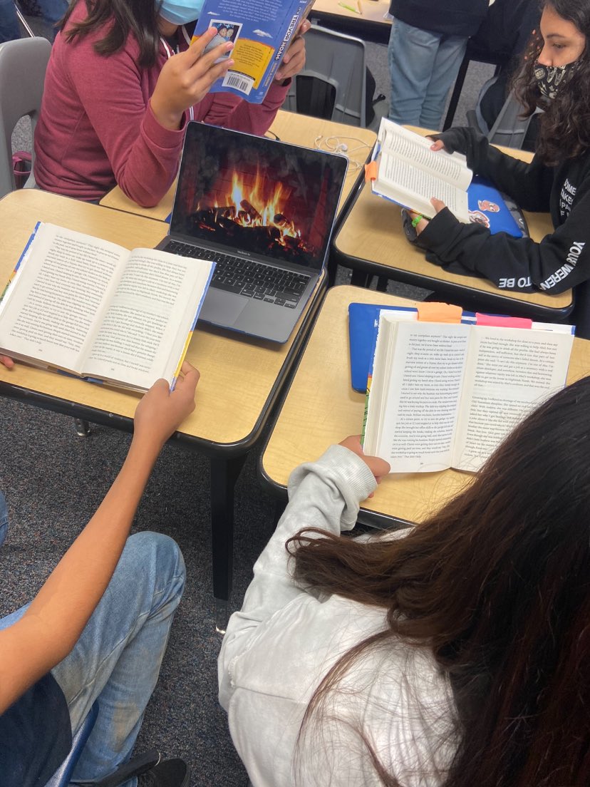 During the rain yesterday, one group decided to read by camp fire 🔥.