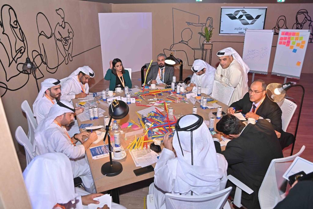 AqdarWS's tweet photo. During #AqdarLab activity in its second day, the participants have gathered around the table to discuss activating the role of society in achieving the fifty projects
#AqdarWorldSummit https://t.co/NrIVjGePxV