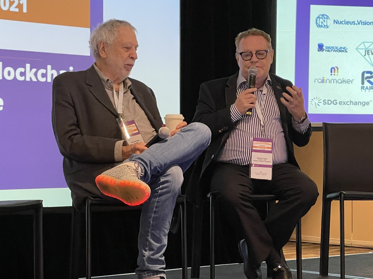 adryenn's tweet image. Discussing the most random topics with @michaelterpin,   @NolanBushnell is by far the most entertaining fireside chat at @coinagenda thus far. We all agree we could listen to them for hours! And those shoes!!! Love him! #coinagenda