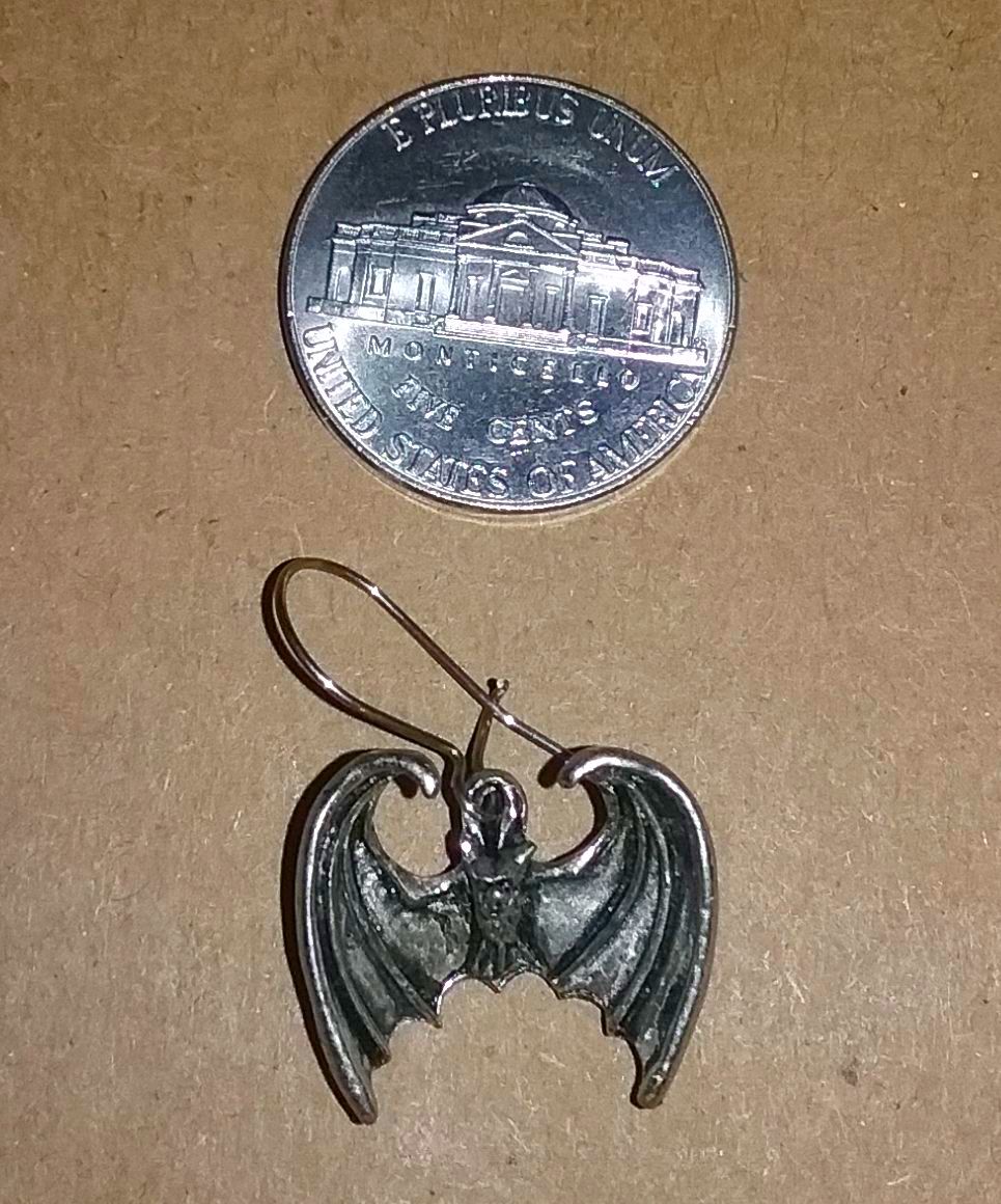 @Metalmike3 Posted my Ozzy and Black Sabbath pins before

Don't think I showed you my Ozzy Bat but if I did - I apologize.

(Also handmade pewter and imported from UK in 1989 or 1990).

Got some skulls, skeletons, and dragon claws too

#OzzyBatEarring  #OzzyOsbourne #BlackSabbath #MetalRules