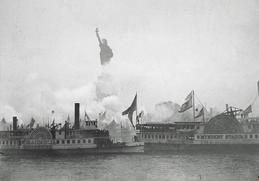 Enhanced photo from the Statue of Liberty's dedication in 1886. Photo from water with copper colored statue surrounded by cloudy skies and numerous steamships in the forefront.