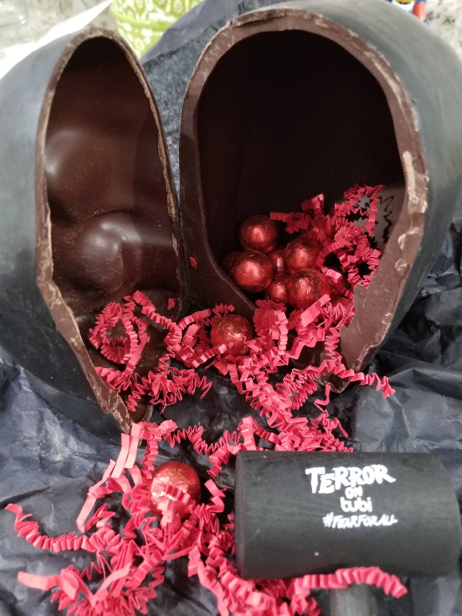 HauntedMeg's tweet photo. It's storming out, and a large skull with mallet was just delivered. Cracked it open to find glorious red innards. Yummmm. Thanks for the spooky Halloween treat @Tubi! #FearforAll #TerroronTubi https://t.co/4y09387zkU