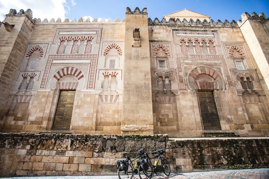CyclingRentals's tweet photo. Taking a moment to pause outside the spectacular Mezquita in Cordoba. The cycling is superb and the sights are truly World Class along the Ruta del Califato in Andalucia. Where will you go cycling this season? #cyclingrentals #cordoba #biketouring #Spain #Andalucia https://t.co/eeb30u5tHR