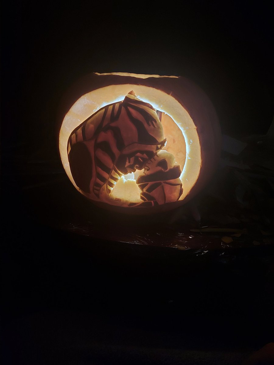 _Astro_K's tweet photo. My fiancée is amazing, look at what an amazing job she did!! Its Ahsoka and Grogu 💚💙

(2 pics of the pumpkin, 1 of myself and my fiancée)

#StarWars
#Mandalorian 
#Grogu 
#babyyoda 
@HamillHimself
@Jon_Favreau 
@dave_filoni 
@disneyplus 
@WookOfficial 
@starwars https://t.co/uj4GQHyghK