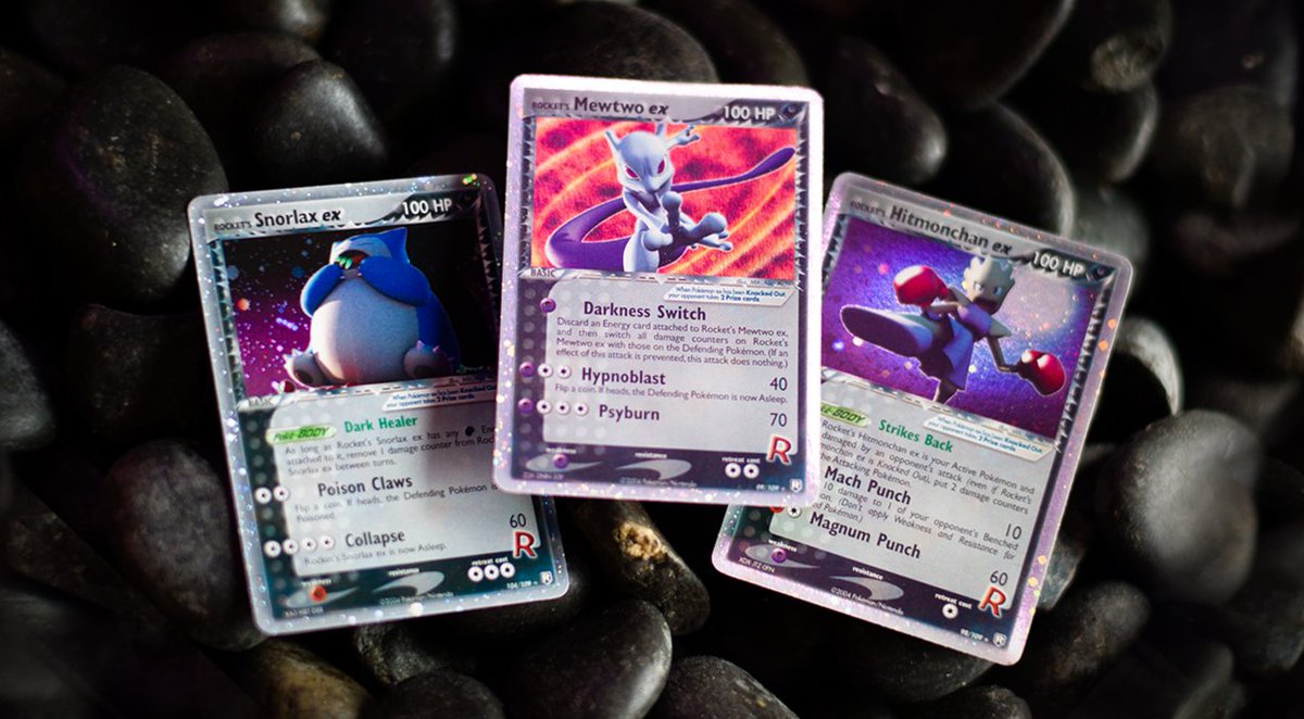 PokemonTCG's tweet photo. When darkness falls over the land, Team Rocket rises from the shadows with Rocket’s Secret Machine cards and ferocious Pokémon-ex! 🌒 The Pokémon TCG: EX Team Rocket Returns expansion had some thrilling new game mechanics! 🌟

What are some of your favorite cards from this set? https://t.co/V058fiHhQ9