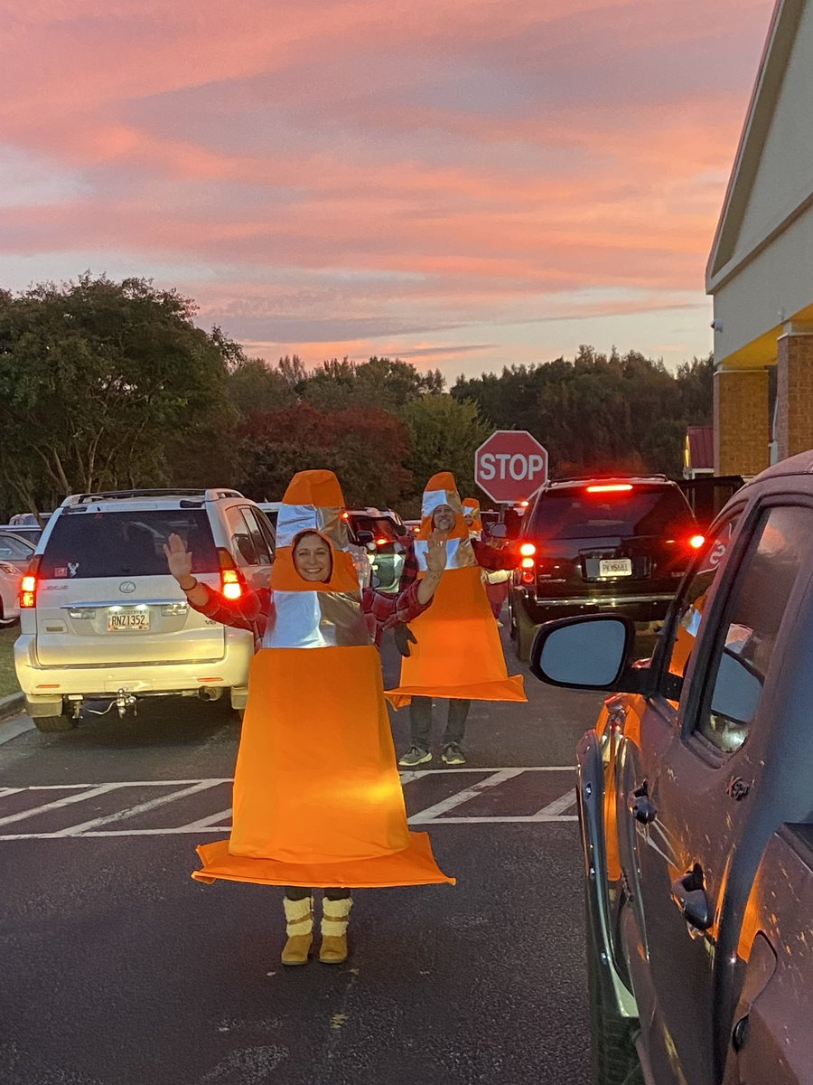 OES_HCS's tweet photo. Educators with a sense of humor! Our Morning Car Team had some fun today directing cars (approximately 450 Colts) as they arrived on campus. What a fun start to the day! #OneTeamOneSpiritOneGoal https://t.co/bZeKqbR068
