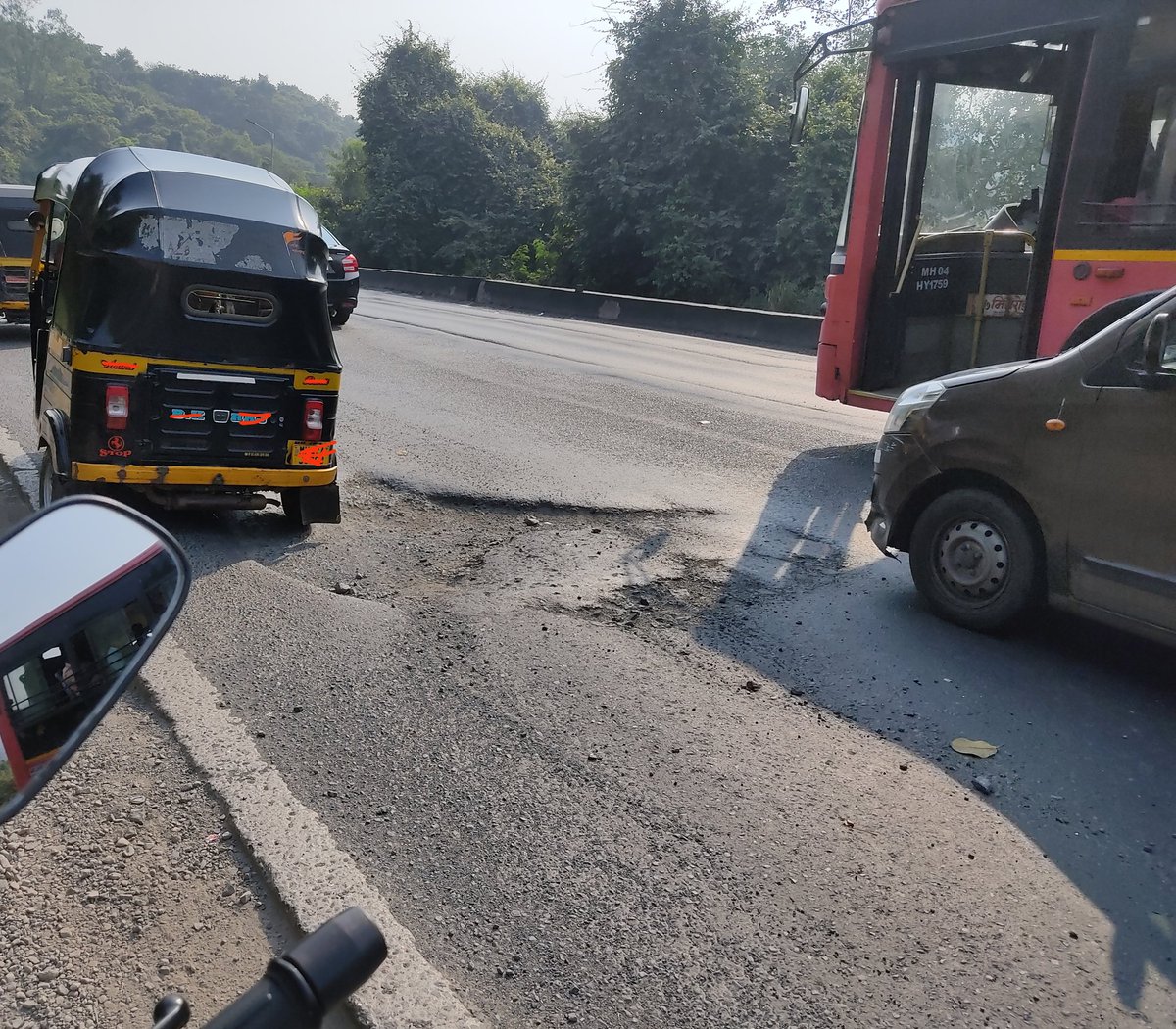 topcat201's tweet photo. @OfficeofUT @mieknathshinde @RoadsOfMumbai Snaps of beautiful repairing of some of countless potholes on Ghodbunder road. Even After orders by Hon. CM and Guardian Minister of Thane to repair all potholes in 15 days. Wow, admire this fantastic work of art. Courtsey MSRDC 👏🏻👏🏻👏🏻. https://t.co/SUl3tu41ak