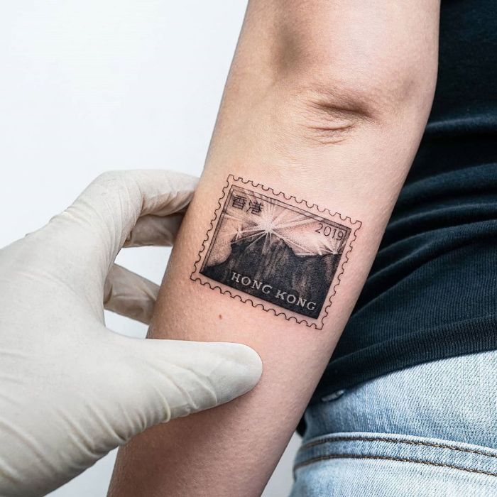 Passport Stamp Tattoo Design For International Travel Lovers