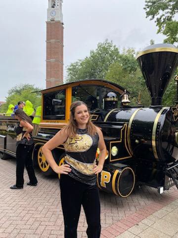 HEHSFlags's tweet photo. Celebrating Hannah, HEHS Class of 2021, who performed as a member of the Purdue Golden Silks this fall! 🏴💛 Hawk and Skyhawk proud of Hannah for continuing color guard participation in college! #BoilerUp #HoffmanHawks #ColorGuardLove https://t.co/4QTXtNjgcP