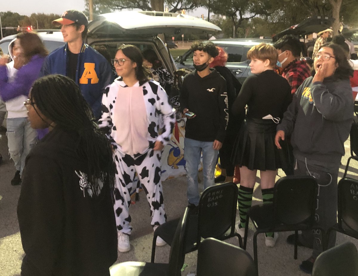 AHHSBand's tweet photo. Caption contest! Caption these three photos from band's participation at tonight's @HeightsFWISD Trunk or Treat sponsored by AHHS student council. We'll start:
1: "Bandtober" was a REALLY long month.
2: Anybody ready for a musical chair test?
3: Is that a tromboneasaurus-rex? https://t.co/C74c9HfeNE