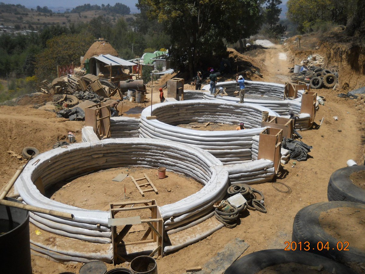 lwhome_org's tweet photo. Here is a bird eye's view of our #superadobe classrooms being built! Those long white bags are #rice bags filled with sand and arranged in layers or long coils.
#calearth #adobeconstruction #ecobuild #greenbuilding #adobehouse https://t.co/kZmBwAp4la