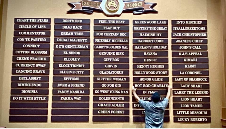 BoatRacingLLC's tweet photo. Hot Rod Charlie’s name has been added to the illustrious Fasig-Tipton Roll of Honor in the sales pavilion. Congratulations to Bob and Sean Feld who originally purchased him. Quite an honor to hang the plaque up too. @Seaneff @FasigTiptonCo  #salesgrad #feldfamily https://t.co/AV49C7bIyI
