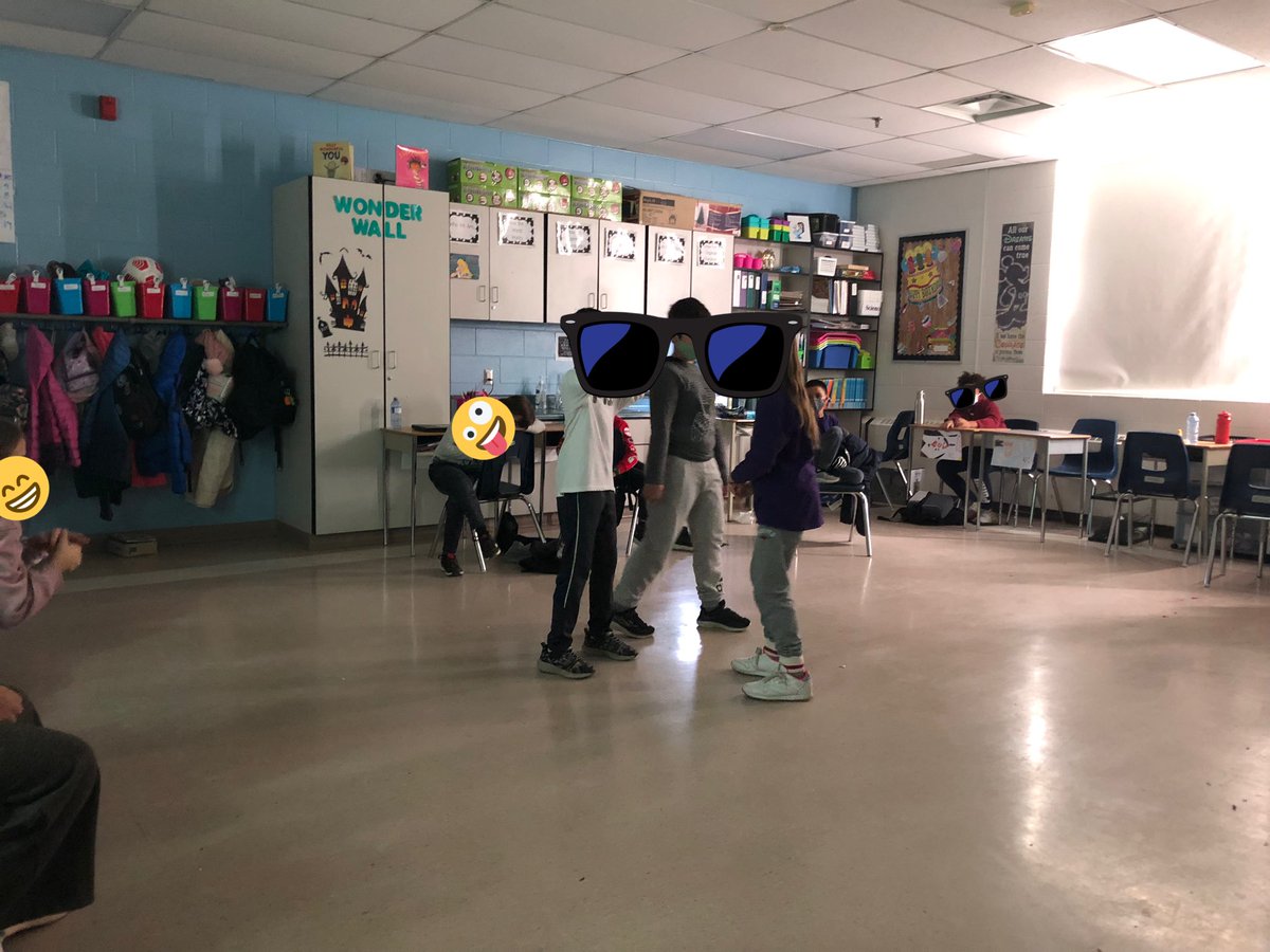Grade4STJ's tweet photo. What’s better than acting in front of your peers? Acting without a script! Students were enjoying some improv drama today when they were chosen from a wheel of names and given the person and place that they would act out. End result…some laughs and greats drama! #improv https://t.co/3DFdn65wYT
