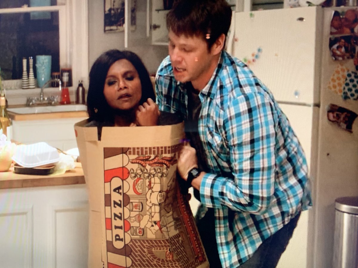 deckeyesbevan's tweet image. I might die. @ikebarinholtz containing a drunken @mindykaling in her giant pizza box for his own good. The Mindy Project is easily one of the greats.