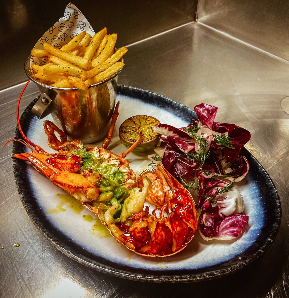 Well shell-o there… 🦞 Tickling our tastebuds and making miso hungry today is this luscious lobster dish from the clawsome Chef, David Hall and crew. Grilled lobster with miso garlic butter, seaweed fries, raddichio, dill and fennel salad. #shellyeah #offthehook #fishmoments