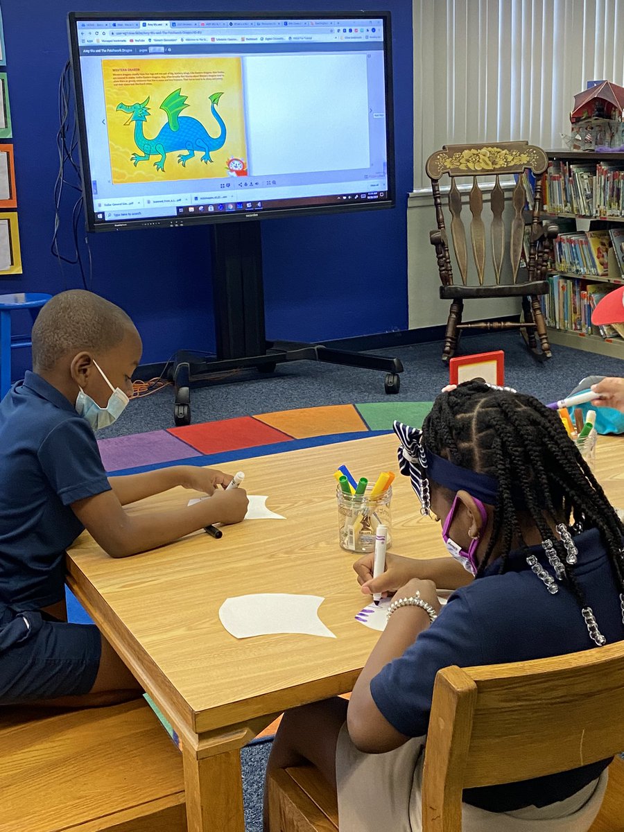 BennettESMedia's tweet photo. Celebrating Read for the Record Amy Wu and the Patchwork Dragon at Bennett in media class , making scales for our school wide Patchwork dragon! https://t.co/mL6dEHqDl0