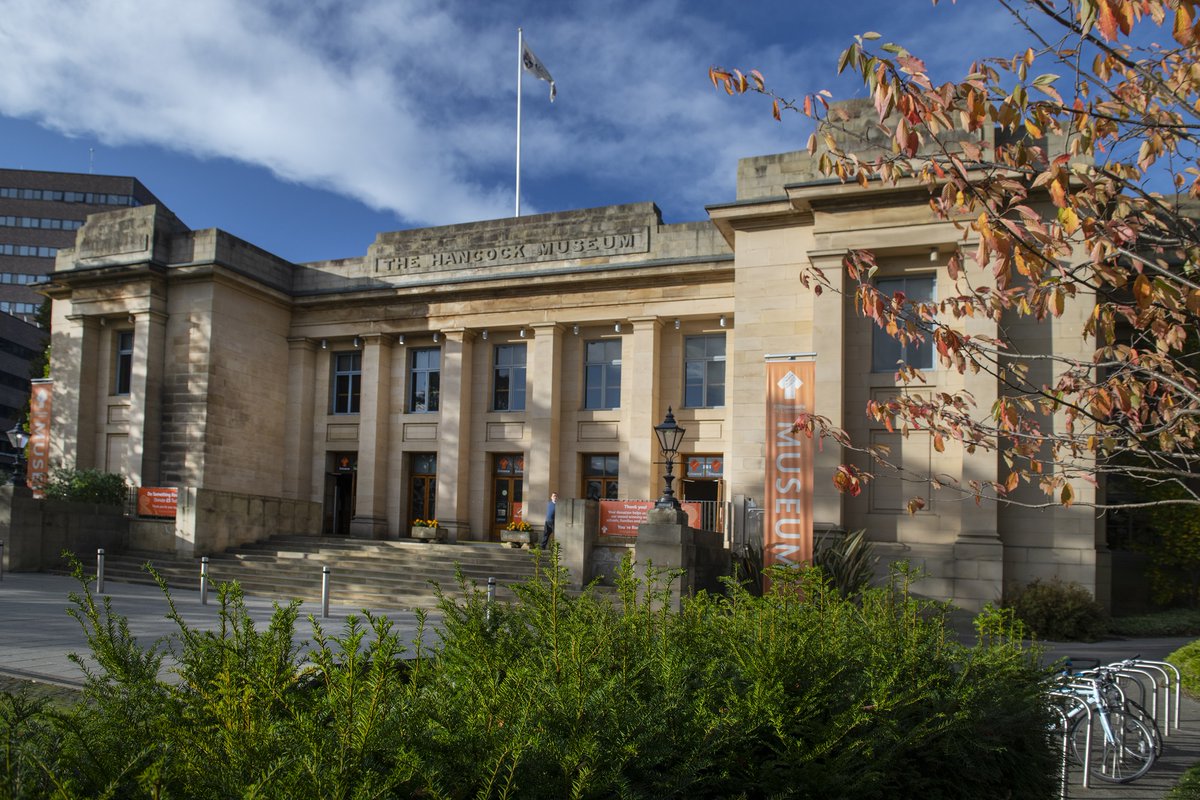 Exterior of the Great North Museum: Hancock, a sandstone building on an autumn day