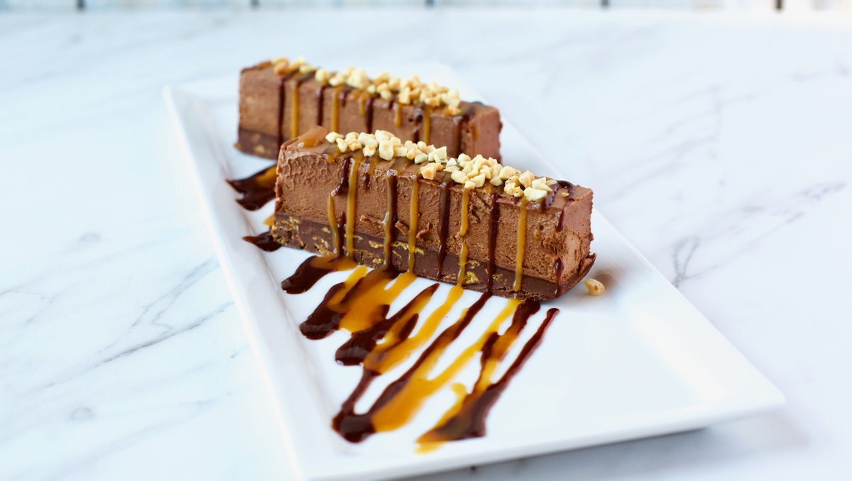 Celebrating one of our favorite flavors today 🍫 Happy #NationalChocolateDay!⁠
⁠
The only thing that can cheer us up on this very rainy day is a bite of <a href="/TrezoMare/">Trezo Mare</a>'s Trezo Chocolate Bars 🤤 ⁠
⁠
Milk chocolate mousse, a crunchy peanut butter base, caramel sauce, &amp; peanuts.