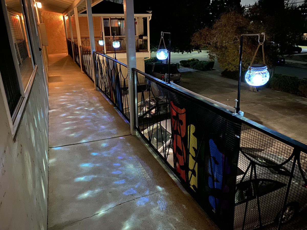 CuppaObscuritea's tweet photo. I may switch out the ‘born this way’ flag with my battle axe lesbian flag when I find it since the born one is a bit faded. But yaaaaasssss need/wanted moar sparkly rainbow lights for my part of the walkway. XD #newapartment #newapartmentdecor #pride #pride🌈 #pridedecor https://t.co/166xK6De7i