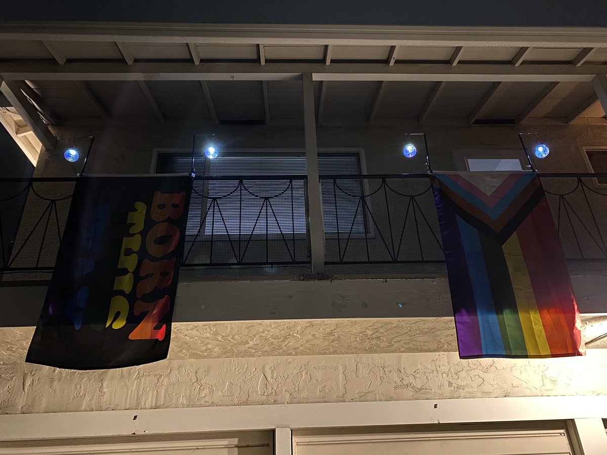 CuppaObscuritea's tweet photo. I may switch out the ‘born this way’ flag with my battle axe lesbian flag when I find it since the born one is a bit faded. But yaaaaasssss need/wanted moar sparkly rainbow lights for my part of the walkway. XD #newapartment #newapartmentdecor #pride #pride🌈 #pridedecor https://t.co/166xK6De7i