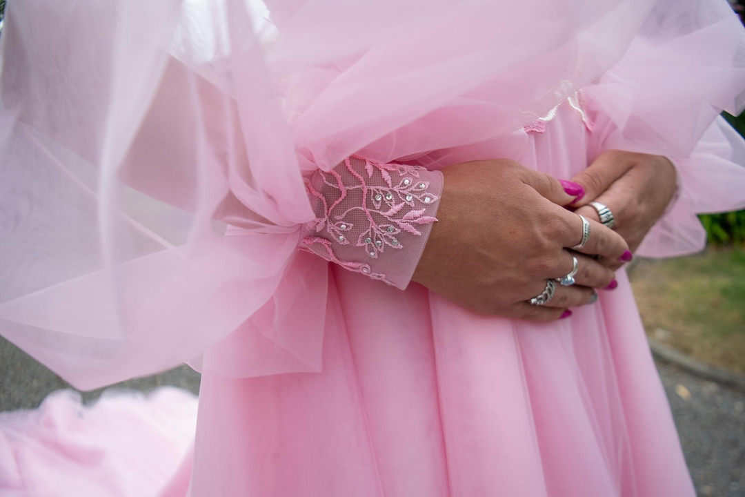 Hand-appliqued cuff detils.