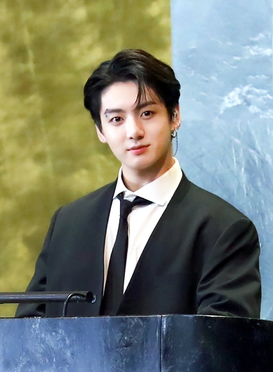 JJK_Times's tweet photo. Jungkook being so iconically handsome and cute at the United Nations General Assembly Hall’s podium https://t.co/DiRur1ZQ0J