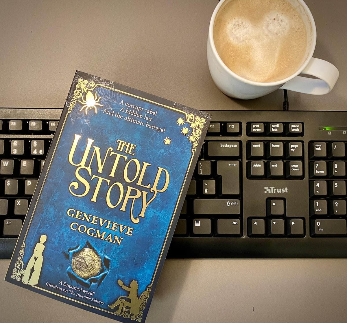 BellaPagan's tweet photo. I love going into the office and seeing my authors' precious books. Especially if I'm told I match them, by happy accident! @GenevieveCogman's THE UNTOLD STORY is amazing & out next mth:https://t.co/V26Ps0dYnl #invisiblelibrary #librarianspies #bookishadventure #velveteffectcover https://t.co/B7MIOMrqKi