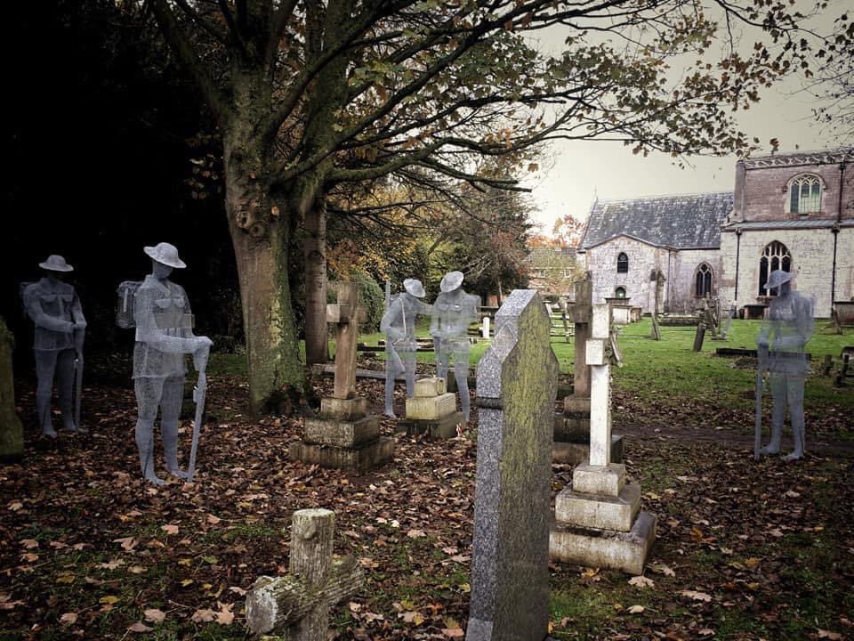 Schmiffy12's tweet photo. An amazing piece of art for Remembrance Day at Slimbridge Church, Glos
‘Ghost soldiers’ (made of wire)  stand over the graves of the fallen. Very moving
#LestWeForget https://t.co/s2gDdxDcg2