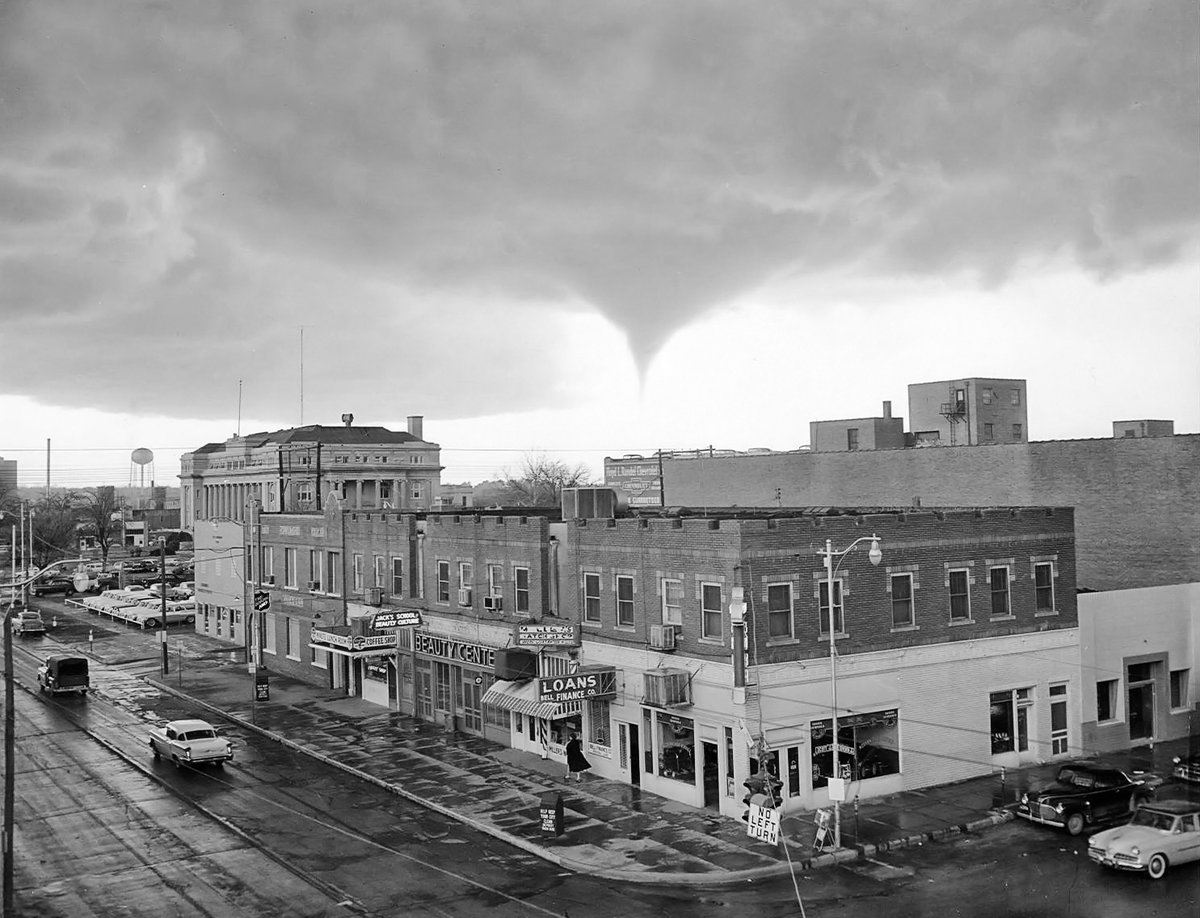 TracesofTexas's tweet photo. A rather incredible photo of a funnel cloud forming over Wichita Falls in 1958.  I could be wrong but it appears that the woman in the black coat is unaware.  

Courtesy Midwestern State University via the Portal to Texas History. https://t.co/tp8j1URsqL