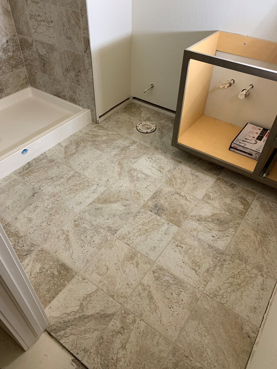 12x12 porcelain tiles in straight pattern on the bathroom floor and shower surround with corner shelf. Bullnoses on all open edges.

#porcelaintiles #denvertiles #experttouchtiling